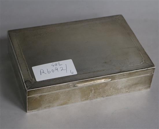 A 1950s engine turned silver cigarette box, 16.5cm.